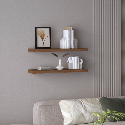 Floating wooden shelf with picture frame and books