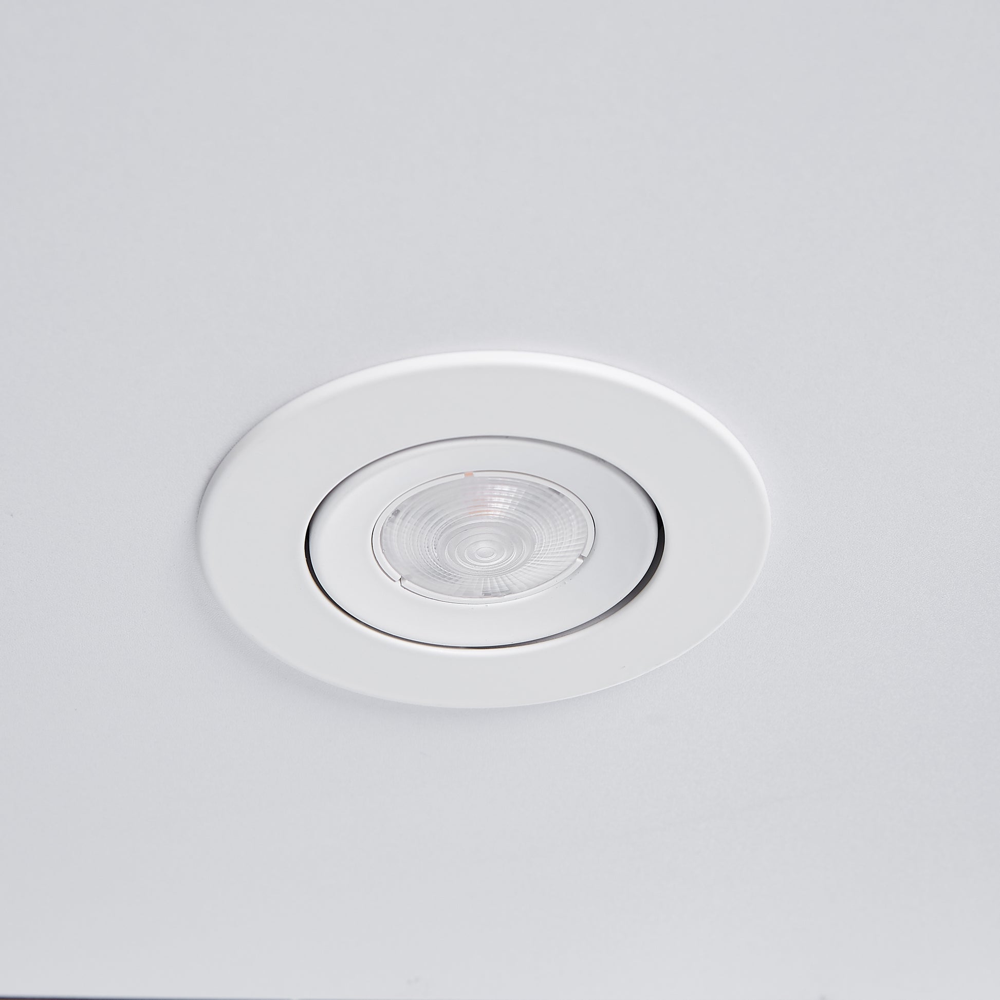Flush mount white LED ceiling light with clear textured lens