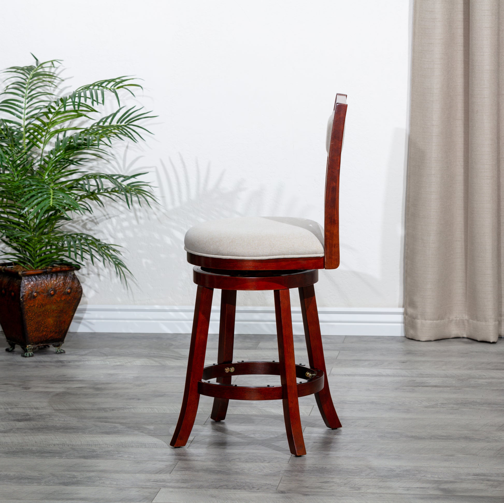 Walnut swivel bar stool with upholstered seat and back