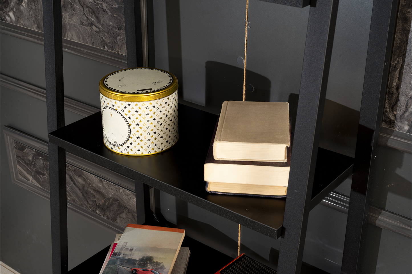 Decorative tin can with gold stars and black outline