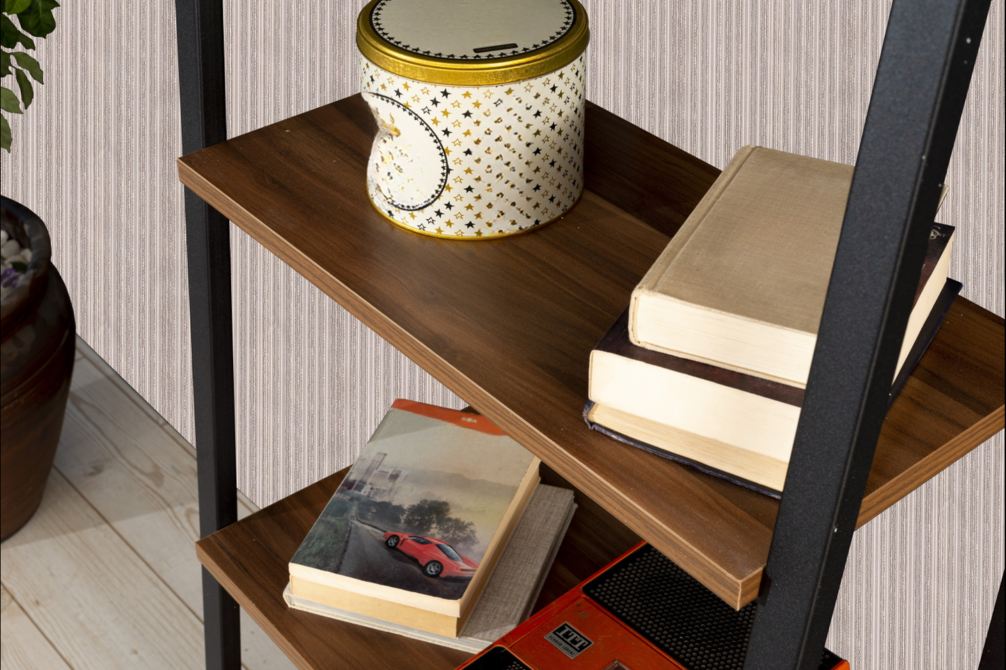 Decorative starpatterned tin canister on a wooden shelf