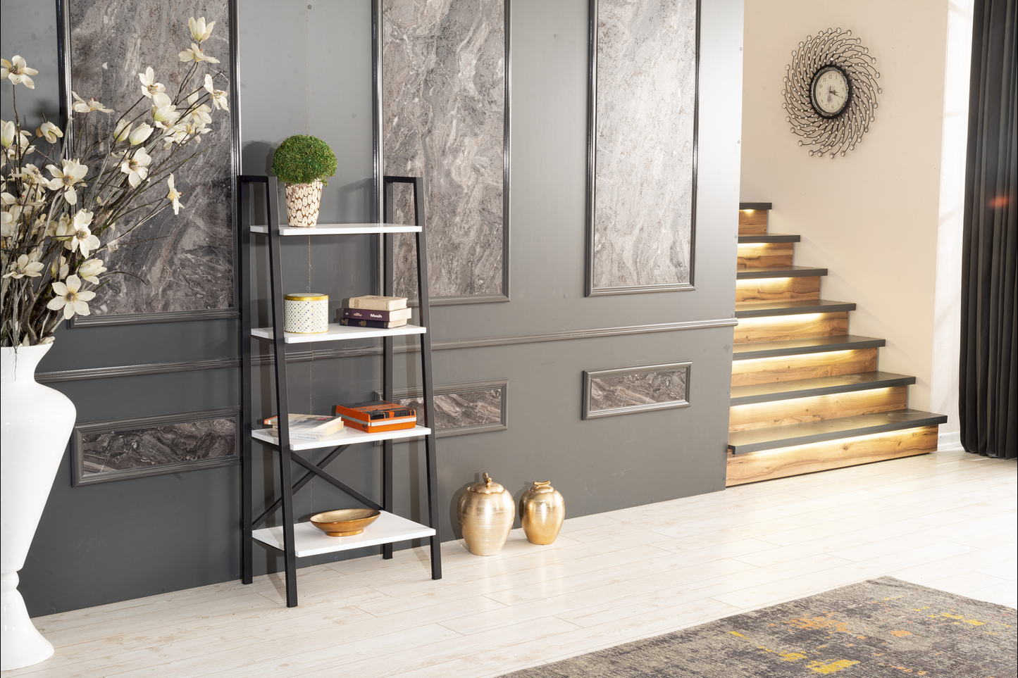 Black and white leaning bookshelf with books and decorative items