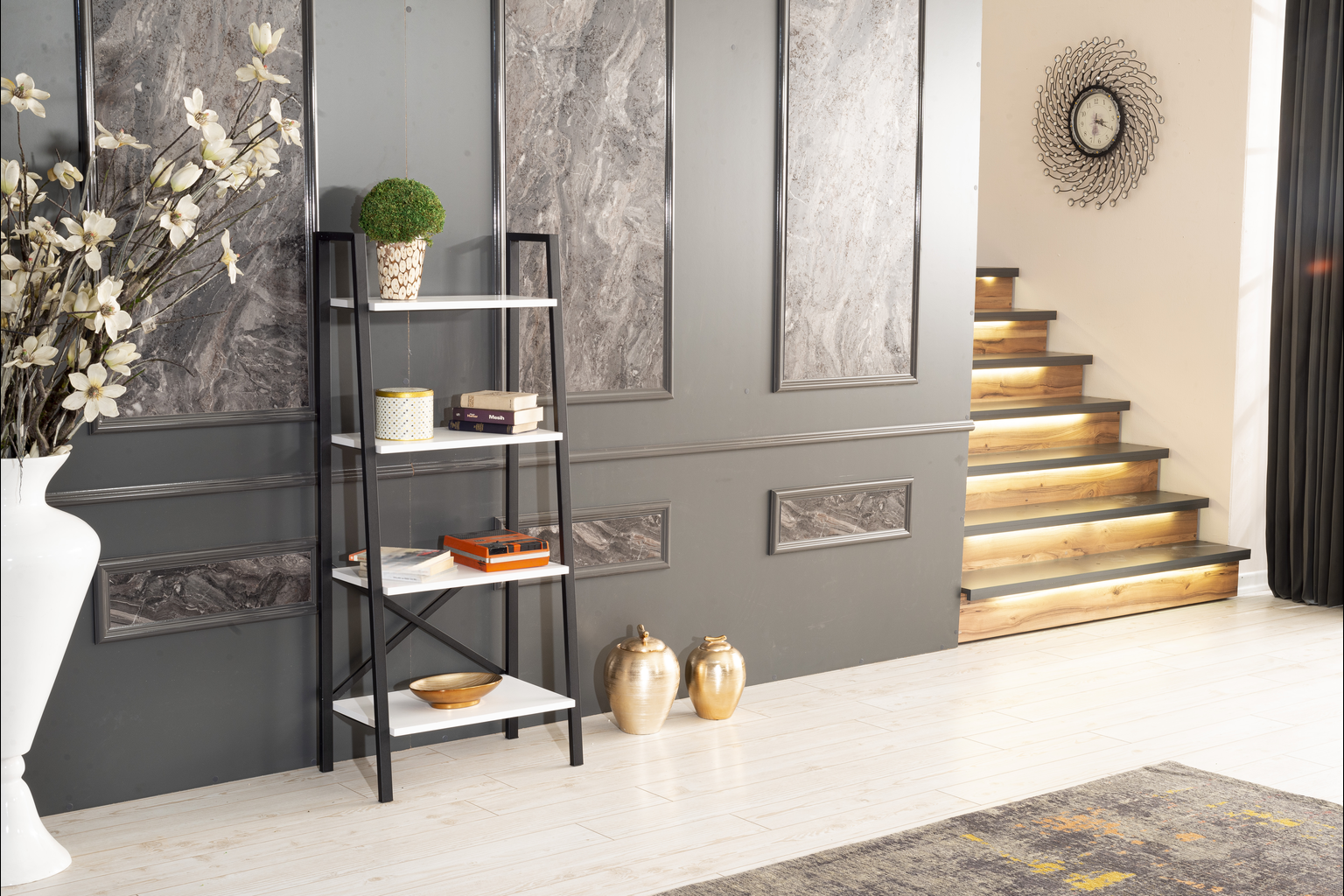 Black and white leaning bookshelf with books and decorative items