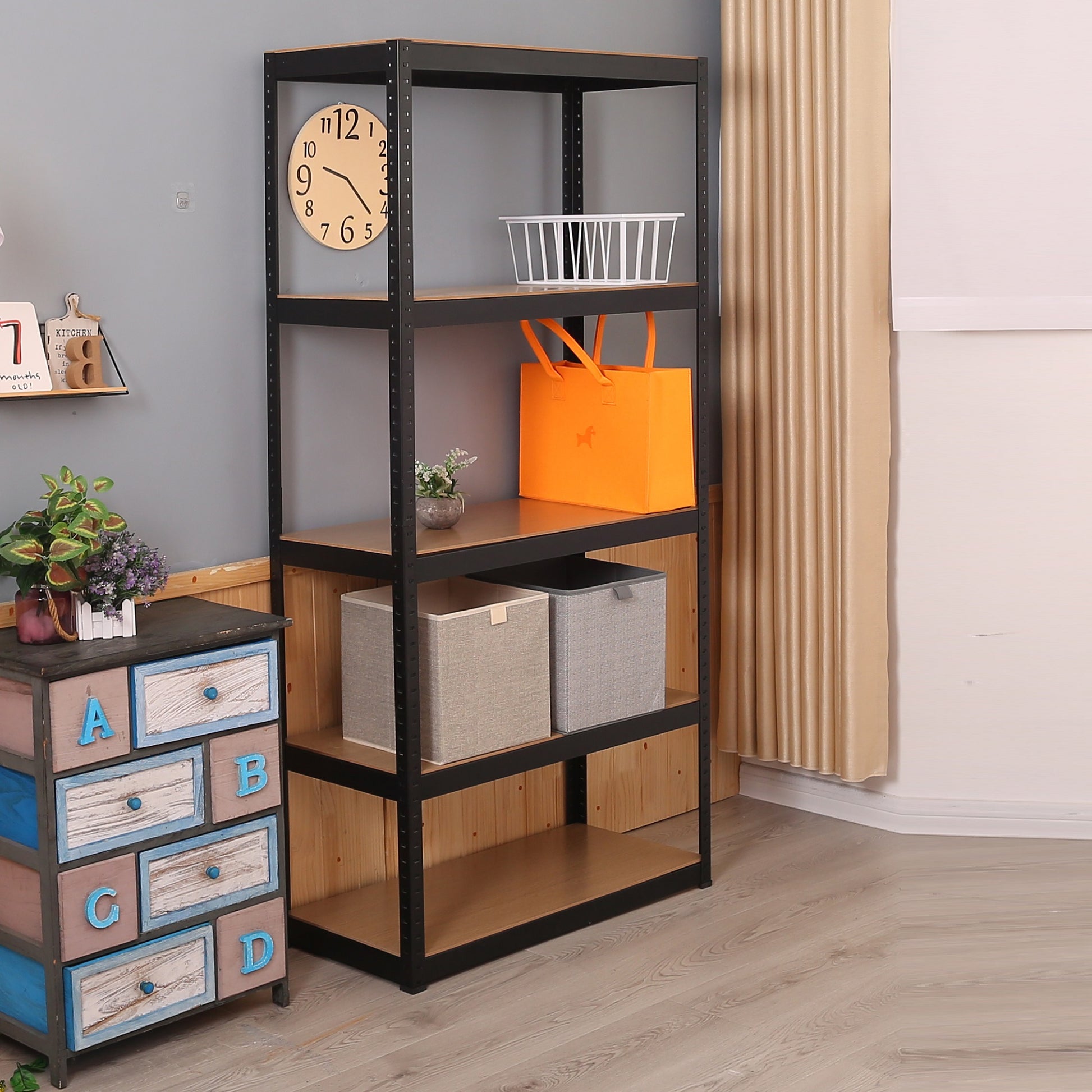 Black metal tier shelving unit with wooden shelves