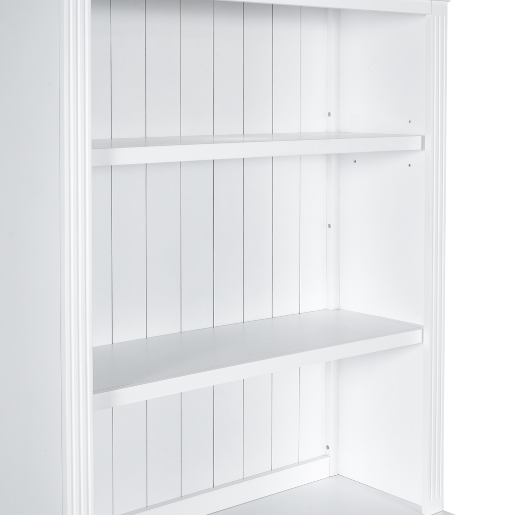 White wooden shelving unit with vertical paneling