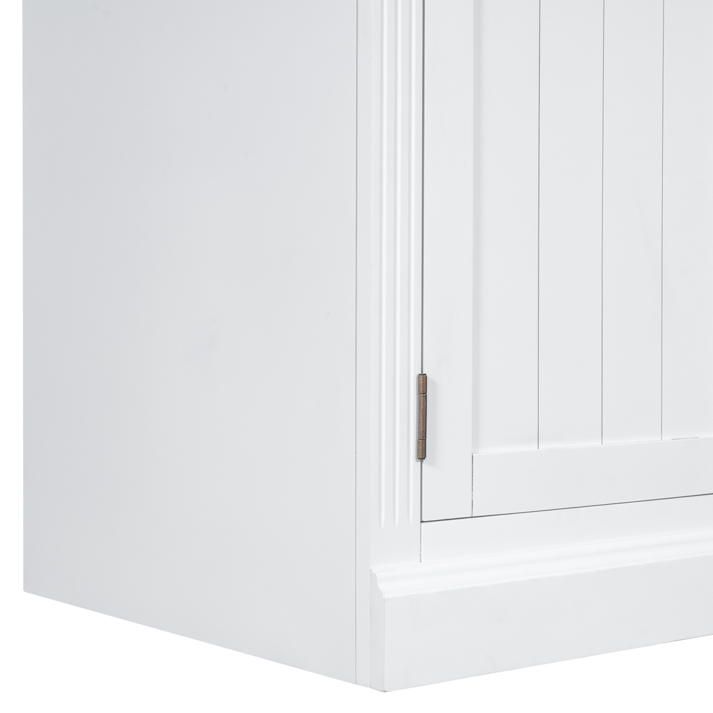 White wooden cabinet corner with detailed panel door and visible hinge