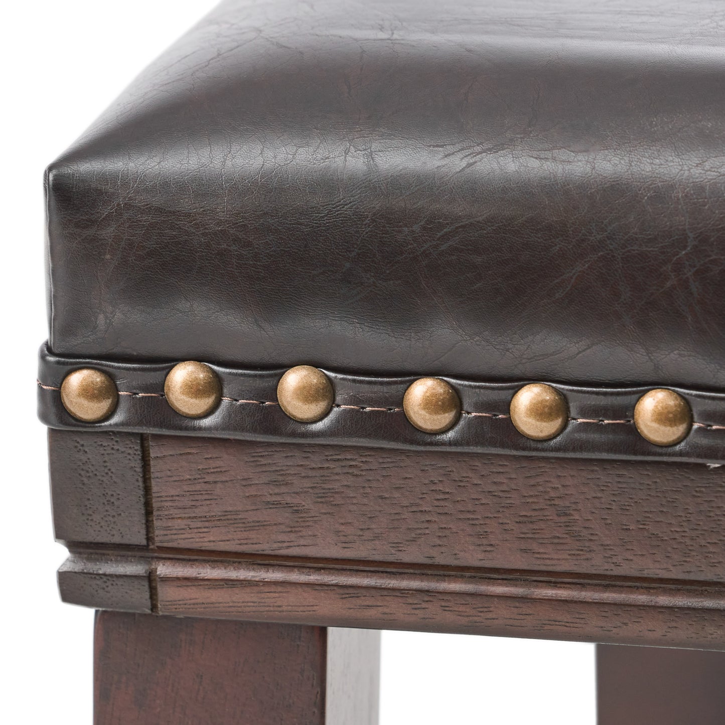 Dark brown faux leather stool cushion with brass nailhead trim and dark wood base