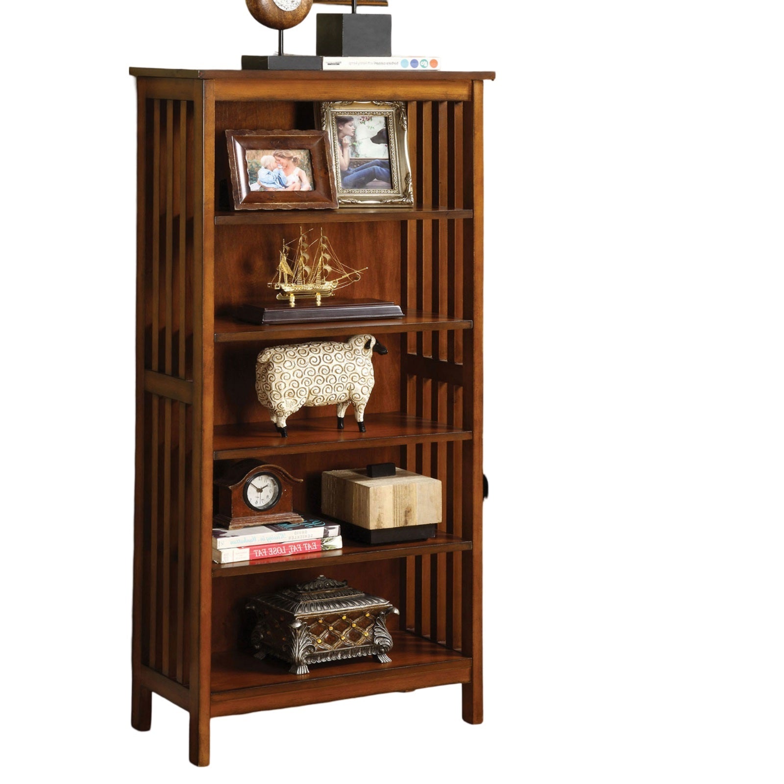 Richly stained oak bookshelf with vertical slatted sides and  shelves