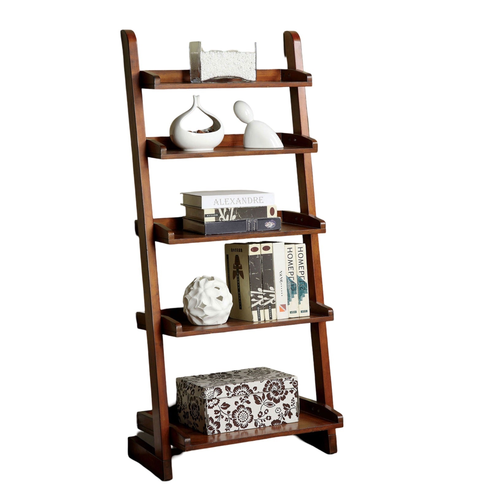 Dark wood ladder bookshelf with decorative items and books