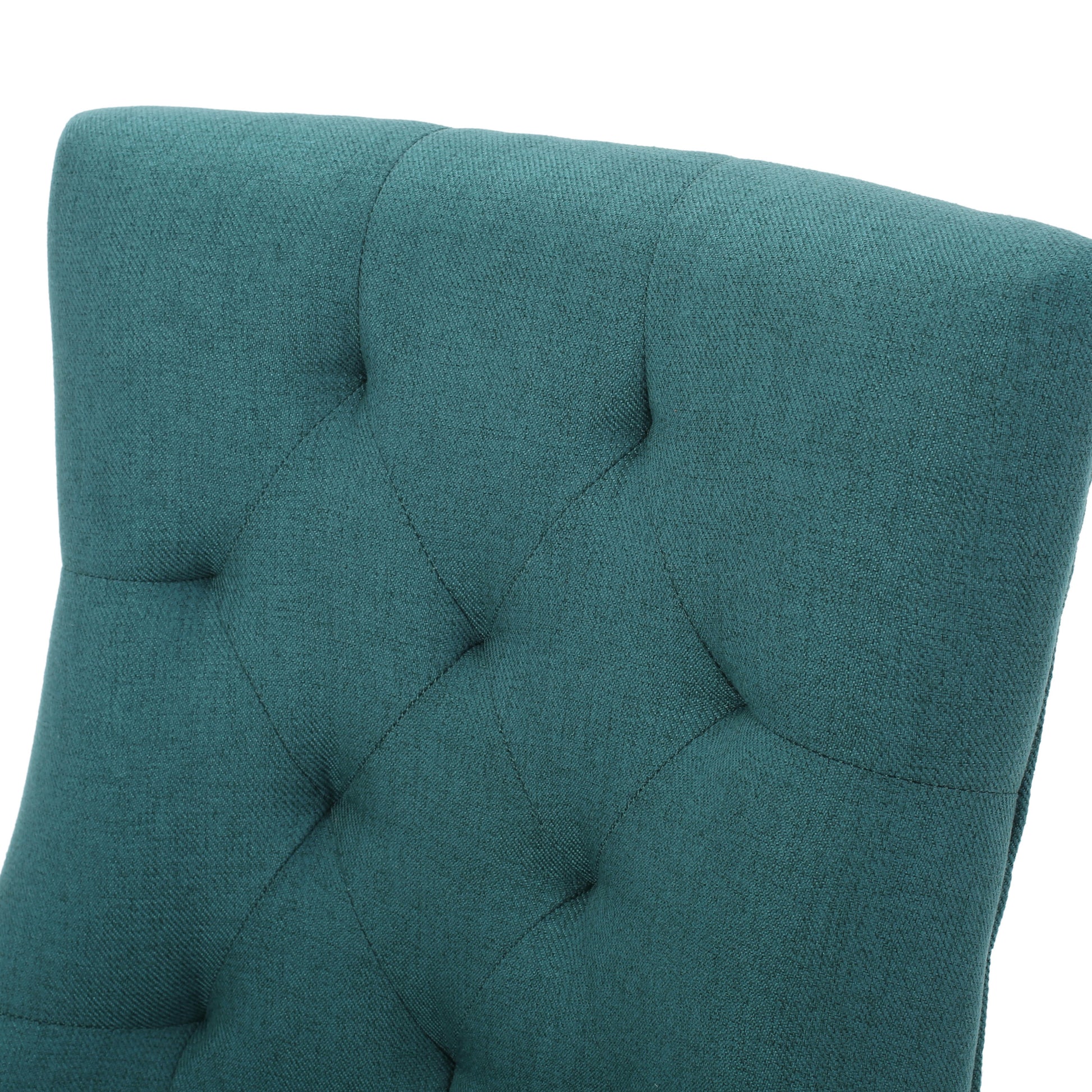 Teal upholstered chair back with diamond tufting