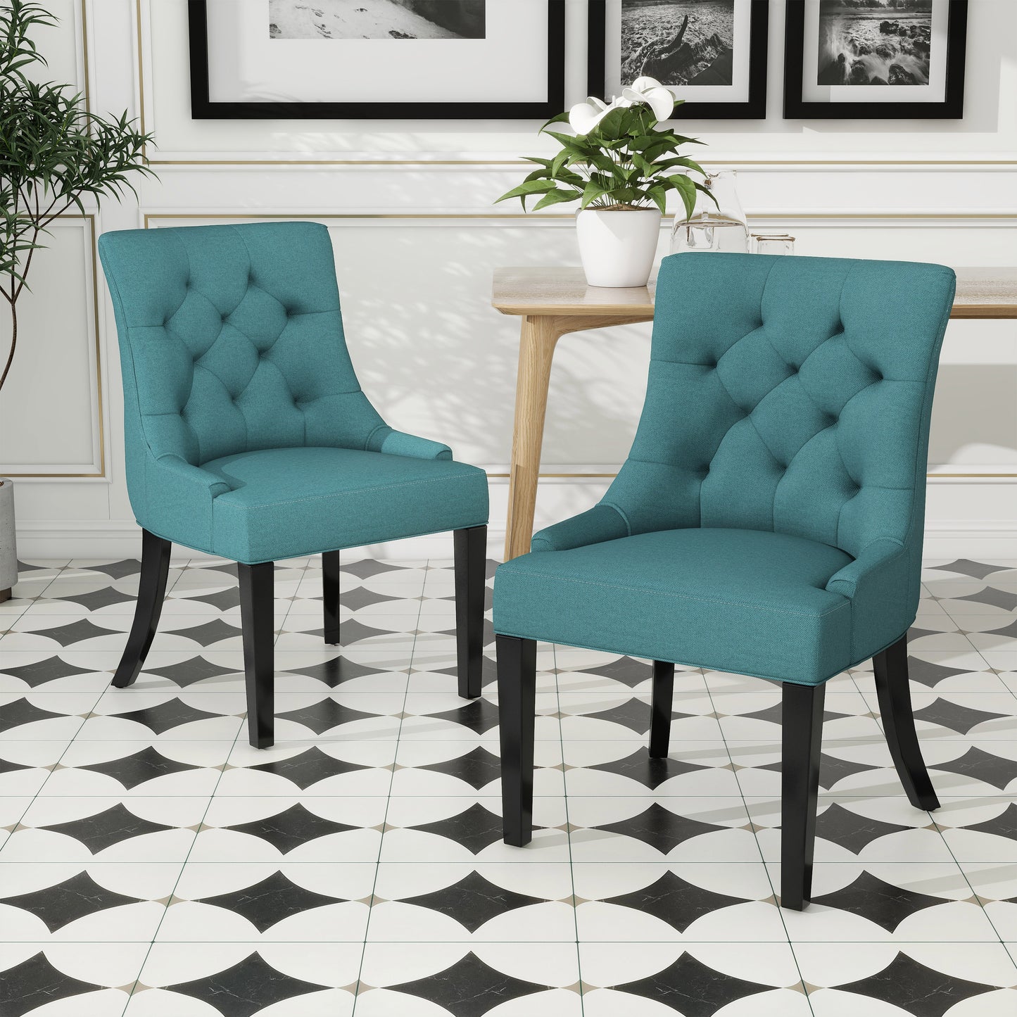 Teal upholstered dining chair with diamond tufting and black legs