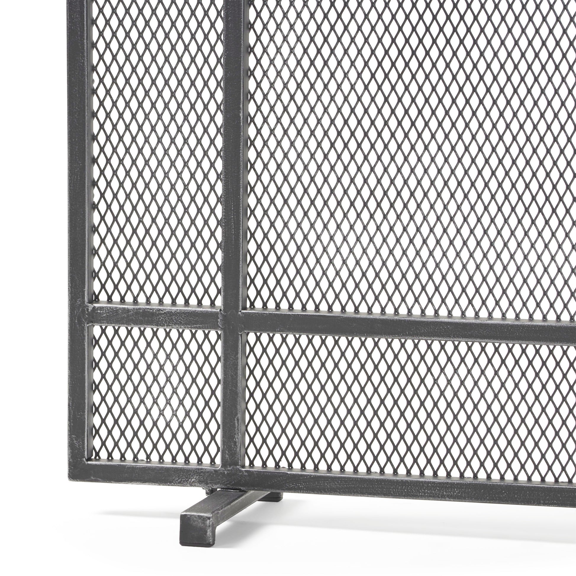 Black metal diamond mesh fireplace screen with sturdy frame and legs