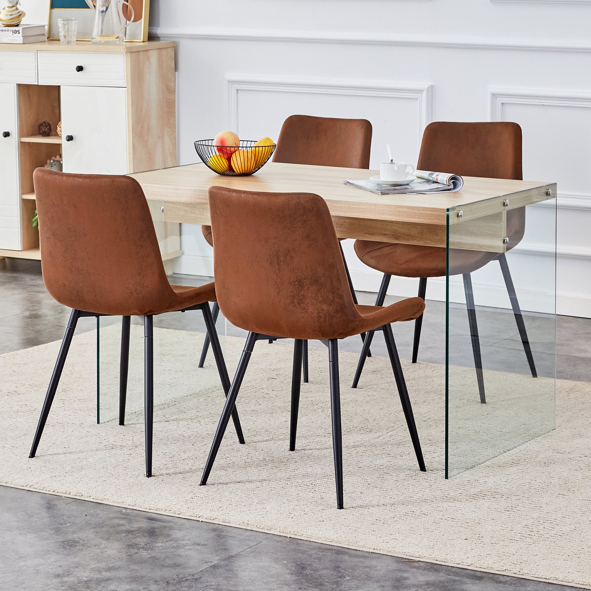 Brown upholstered dining chairs with black legs