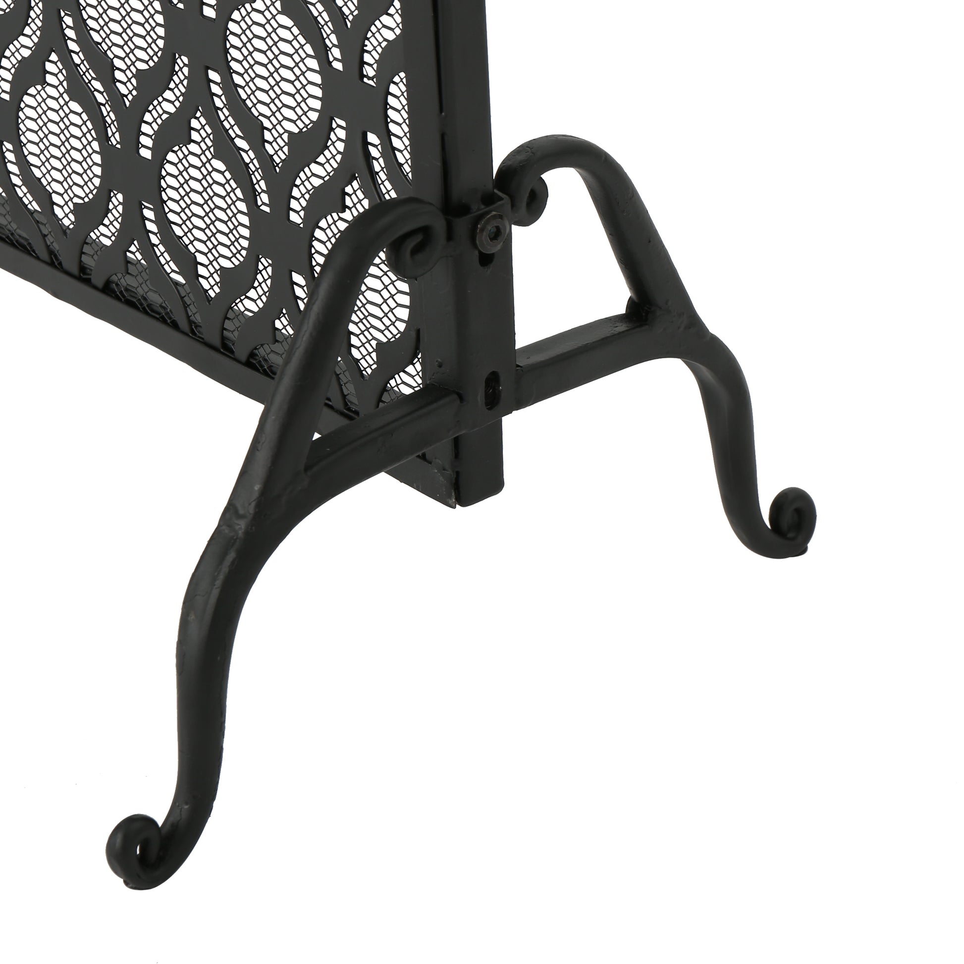 Black metal fireplace screen with decorative scroll legs