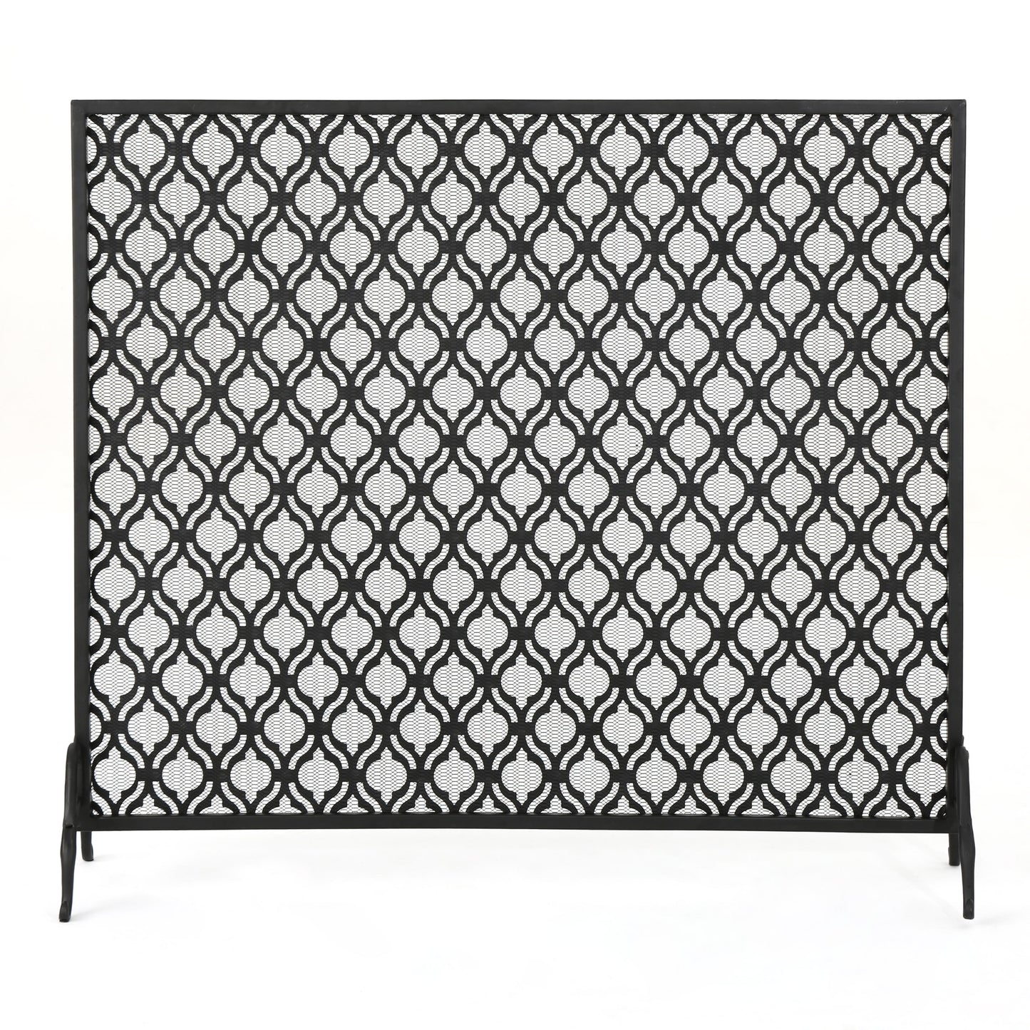 Black metal fireplace screen with ornate quatrefoil pattern
