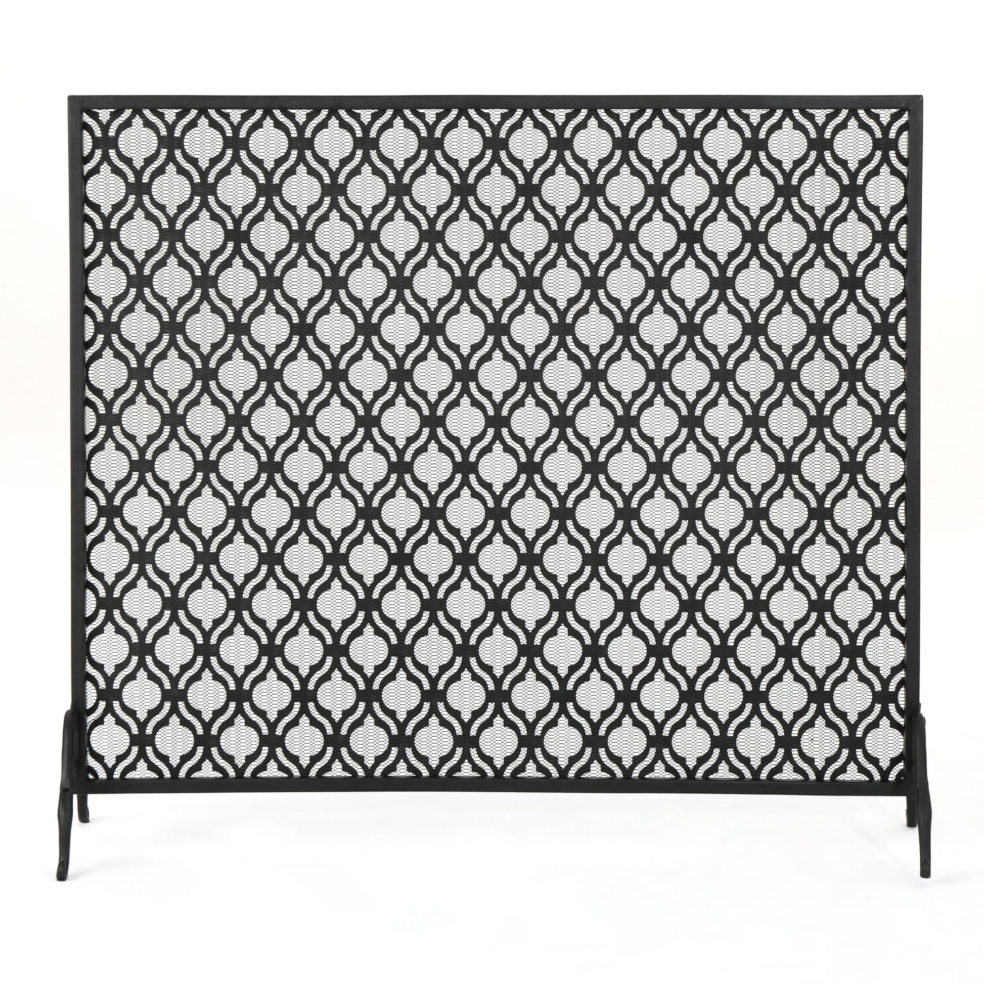 Black metal fireplace screen with ornate quatrefoil pattern