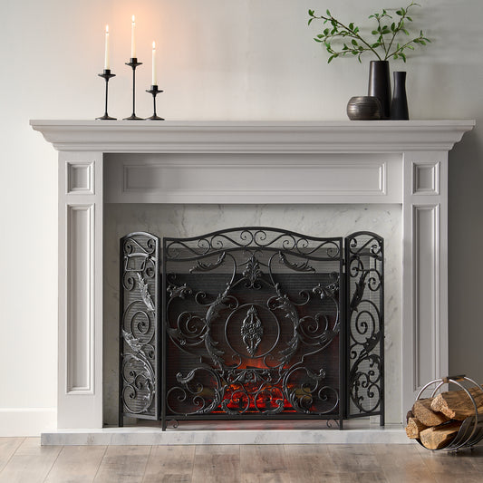 ornate black metal fireplace screen with scrolling vine design