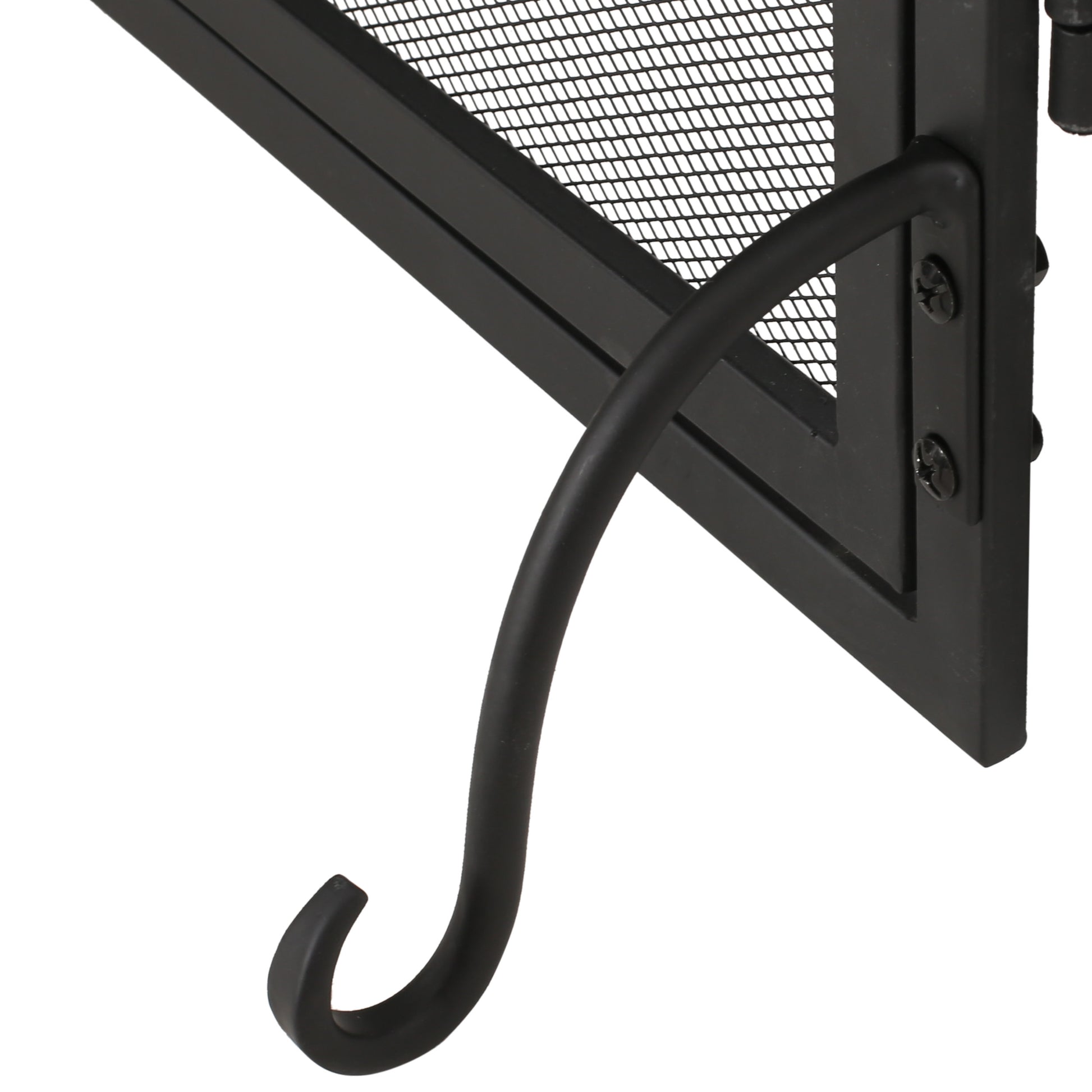 Closeup of black metal fireplace screen corner with curved hook