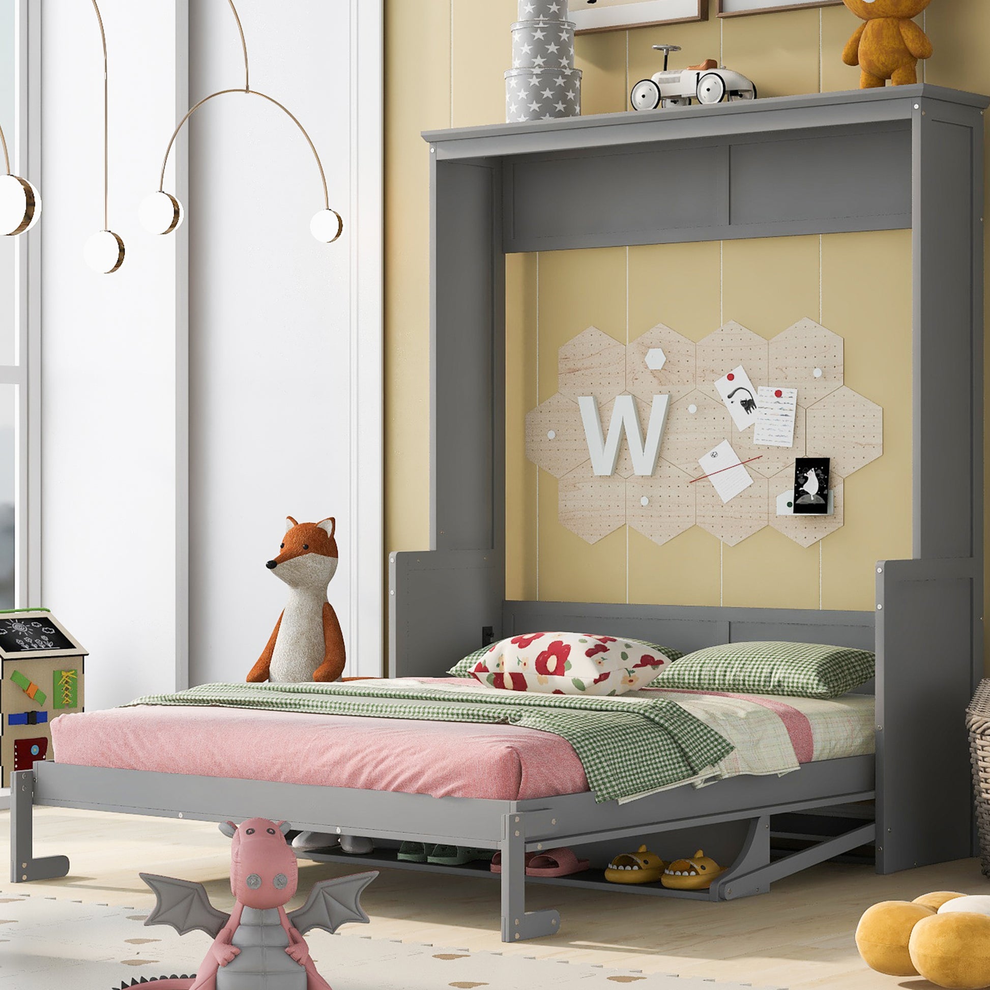 Gray murphy bed with pink bedding and green gingham blanket