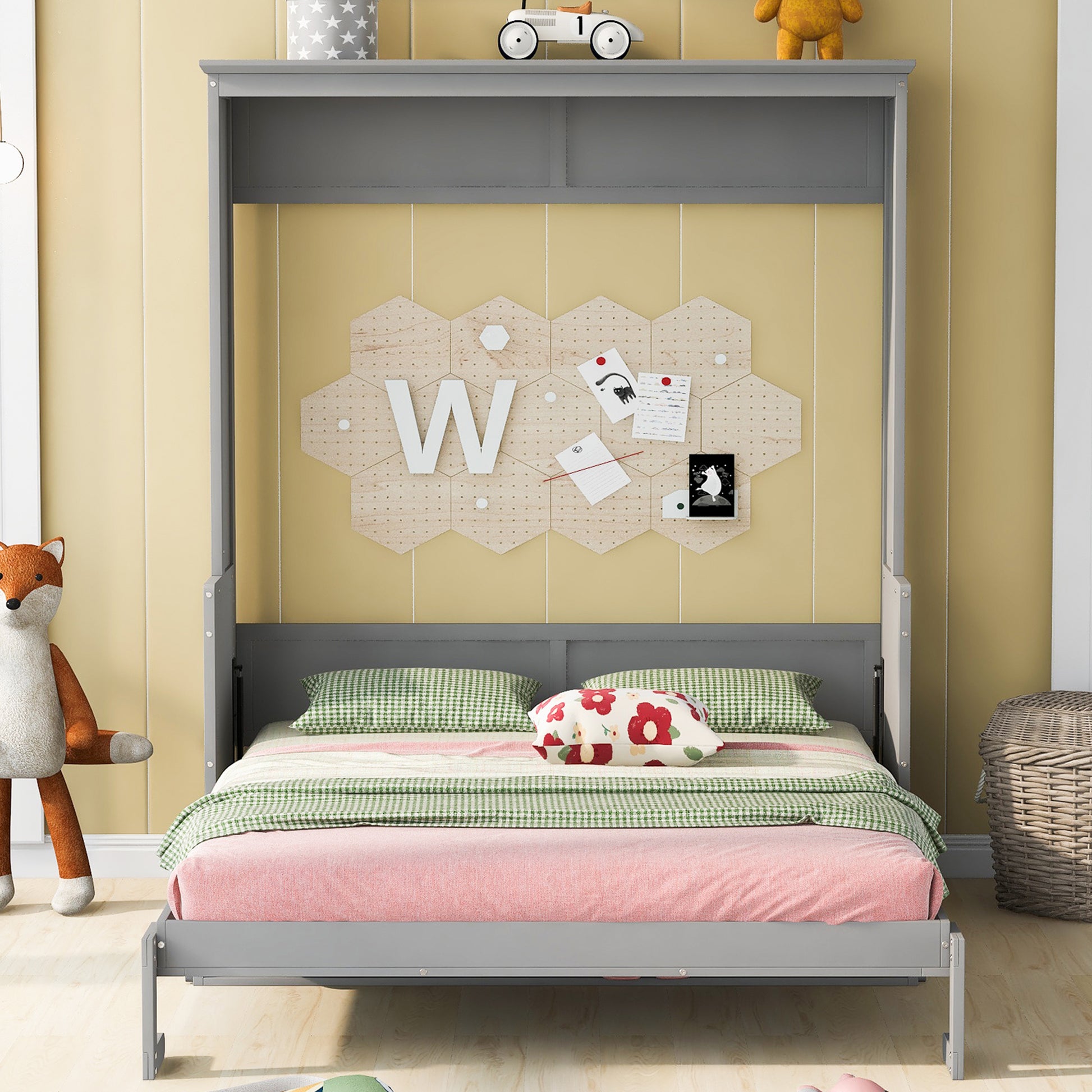 Gray Murphy bed with green checkered bedding and floral accent pillow