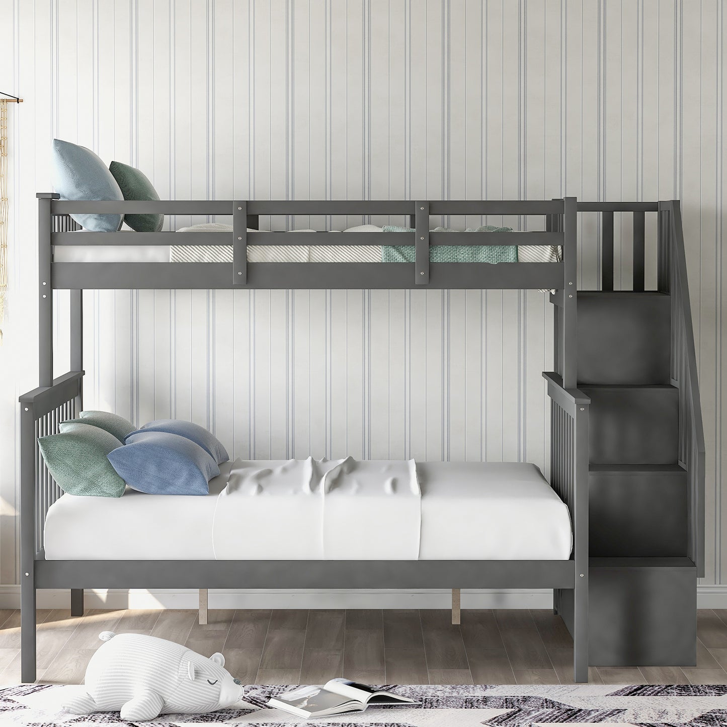 Gray wooden bunk bed with stairs and blue bedding