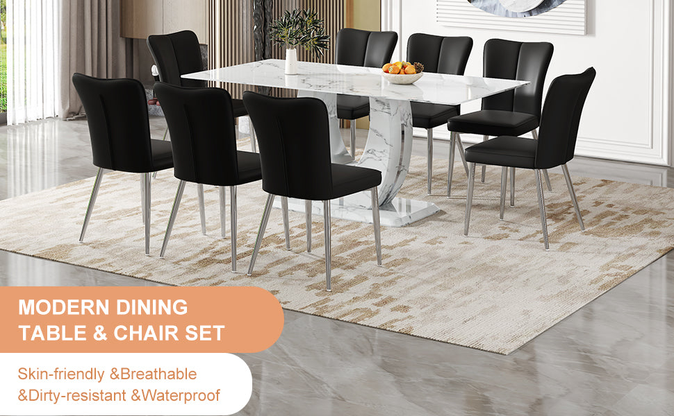 Black upholstered dining chairs with silver legs surround a white marblelook dining table set
