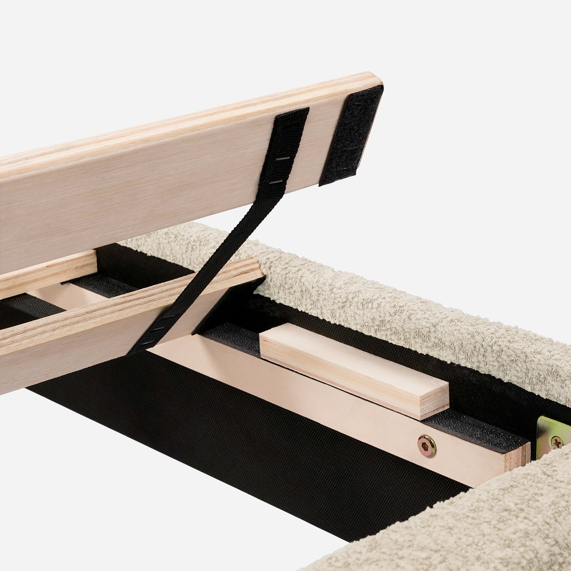 Wooden bed frame construction with black fabric webbing