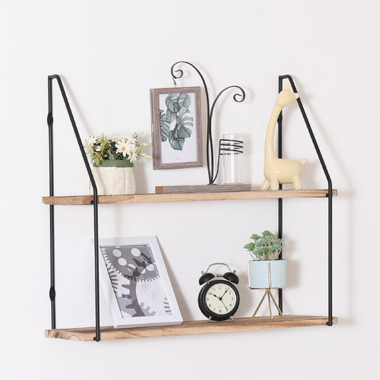 Cream ceramic giraffe figurine on rustic wood shelf