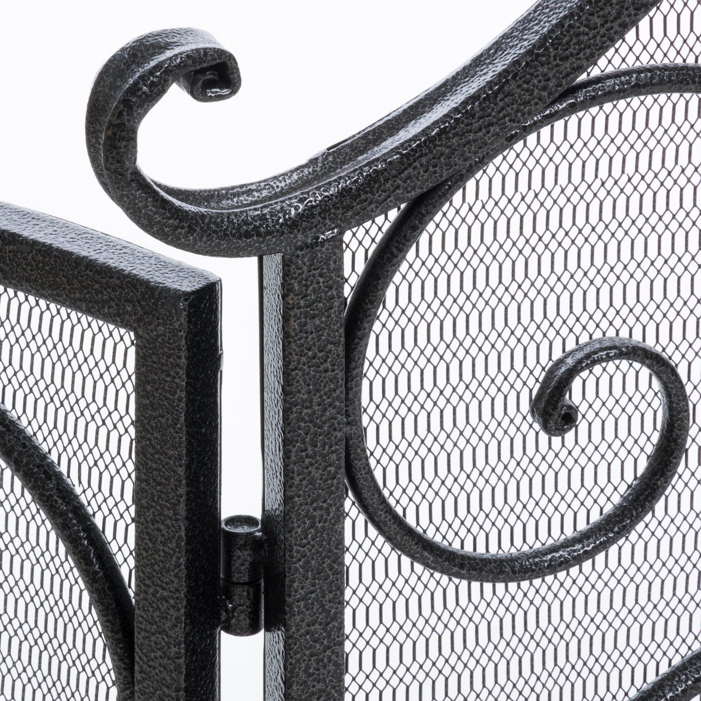 Ornate black metal fireplace screen with curved scrollwork and mesh