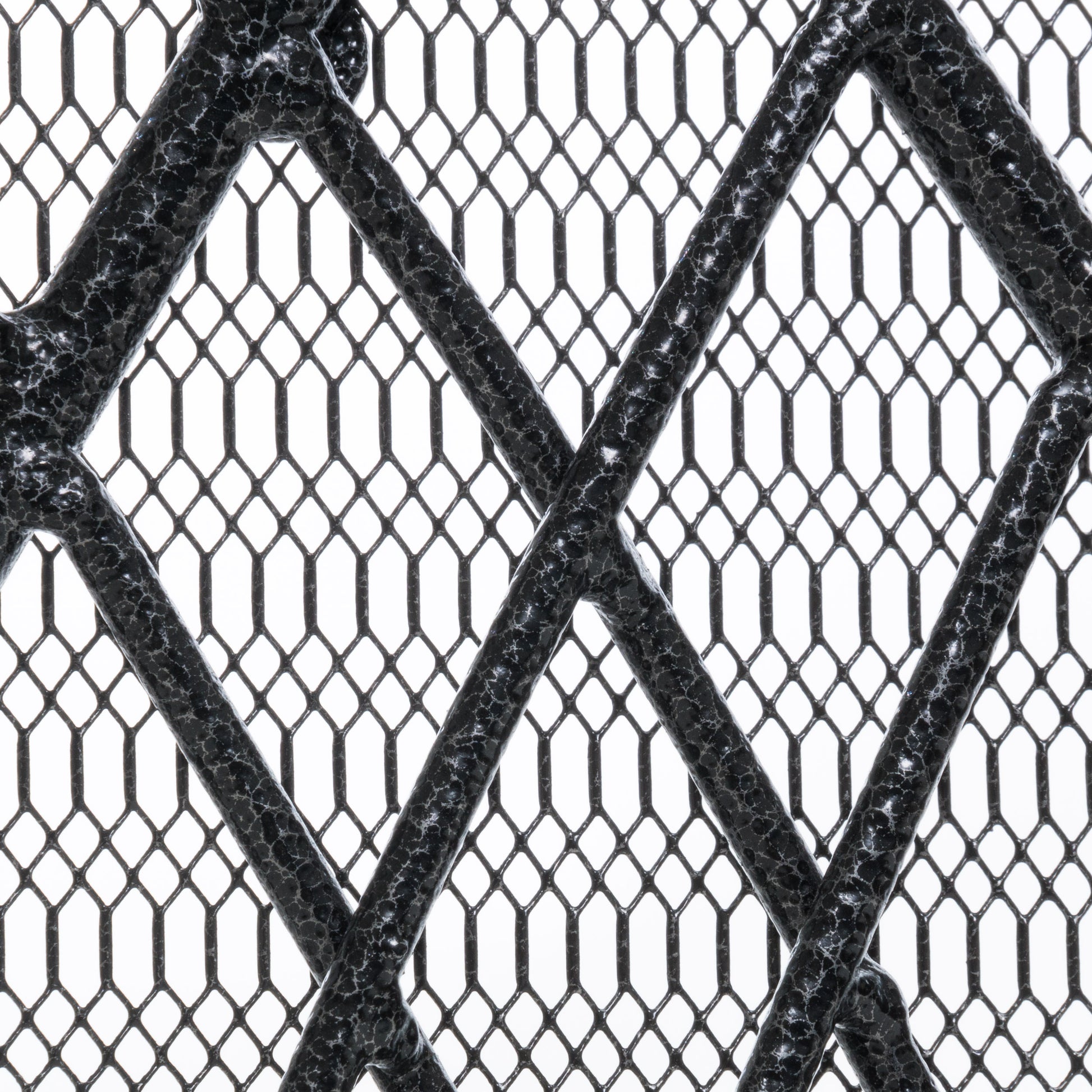 Black textured metal grate with diamond pattern