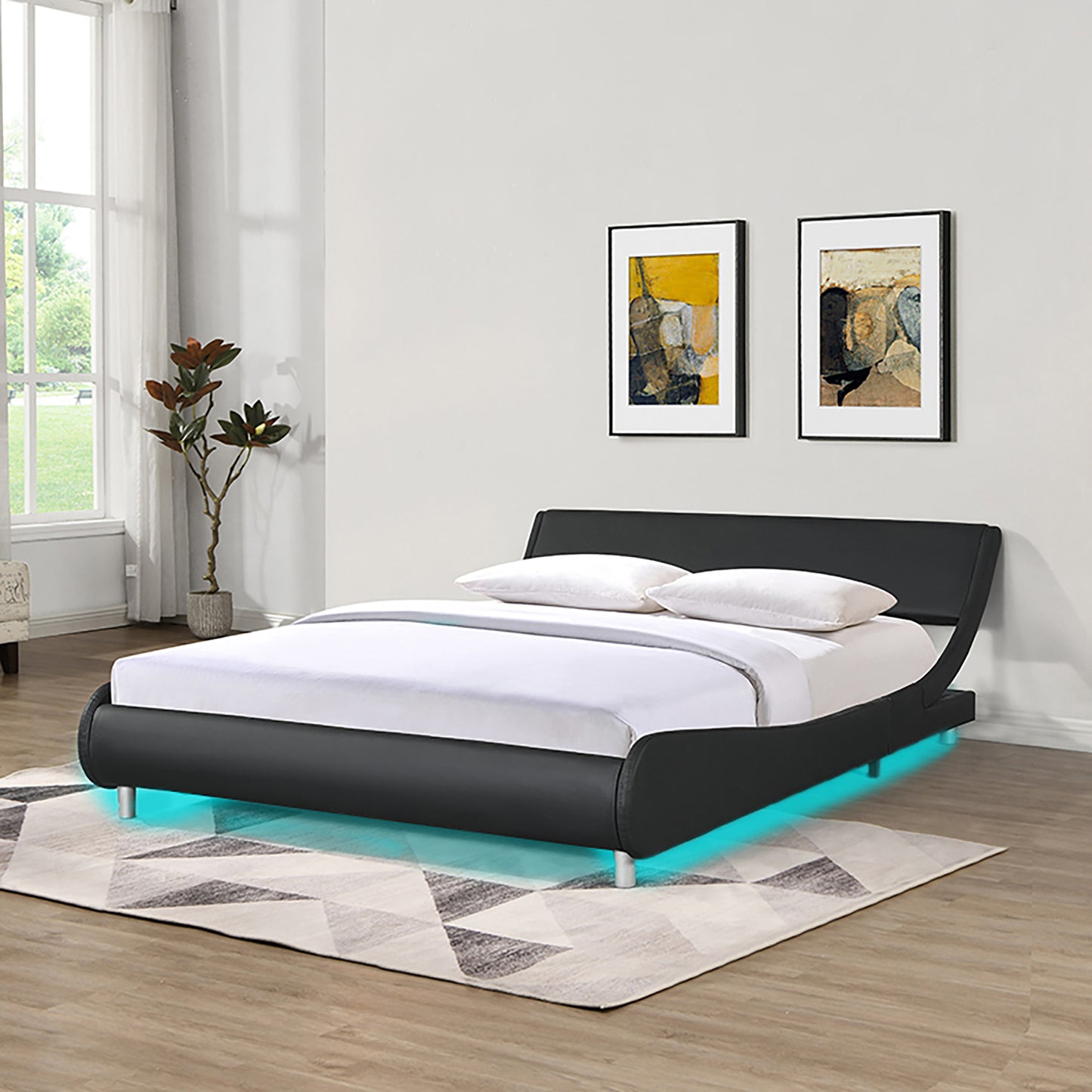 Black faux leather platform bed with integrated LED lighting and curved headboard