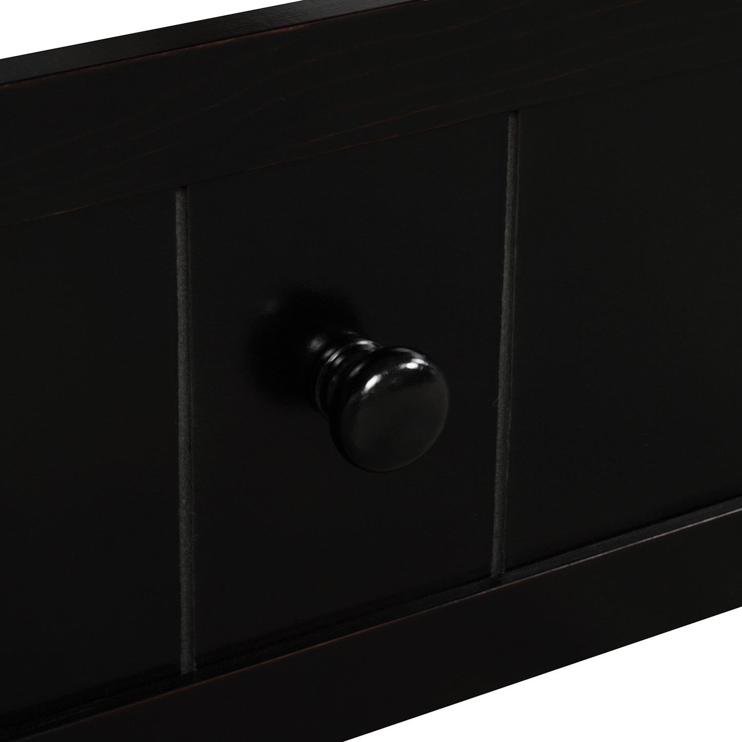 Dark wood drawer front with classic round black knob