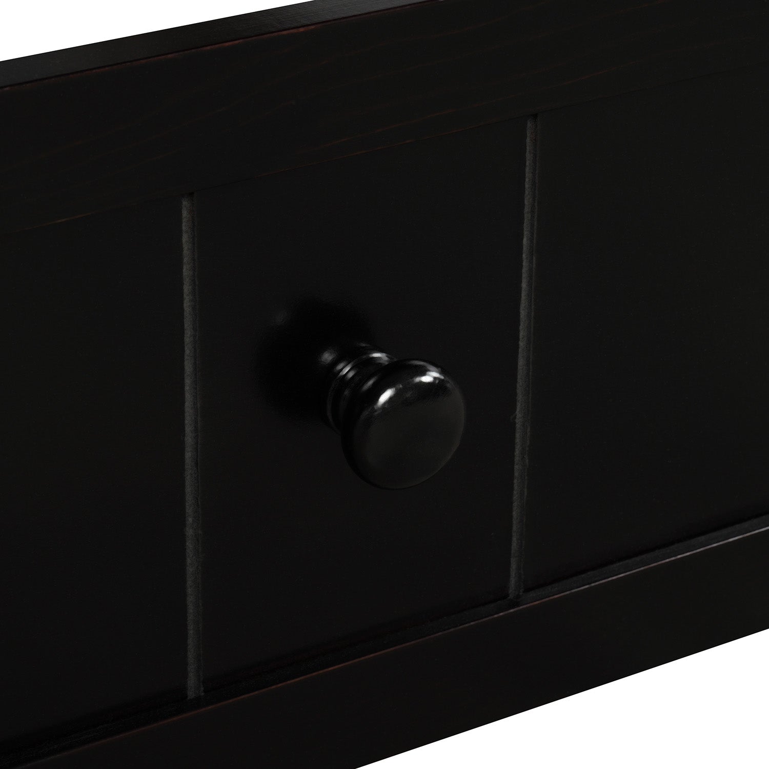 Dark wood drawer front with classic round black knob