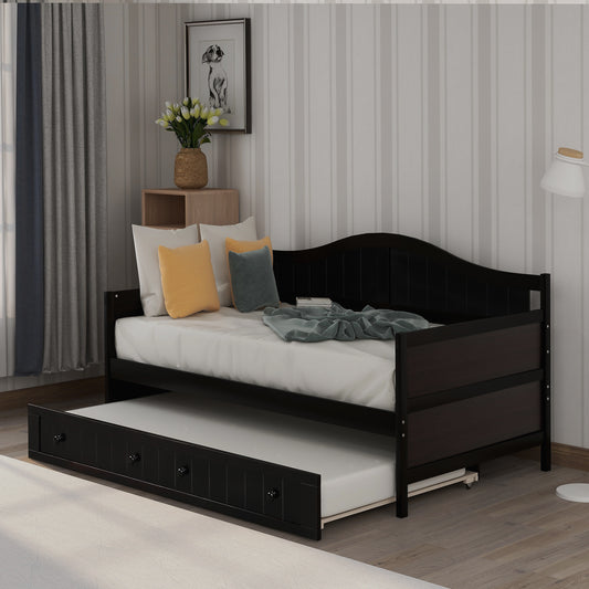 Dark wood daybed with pullout trundle bed for guest room