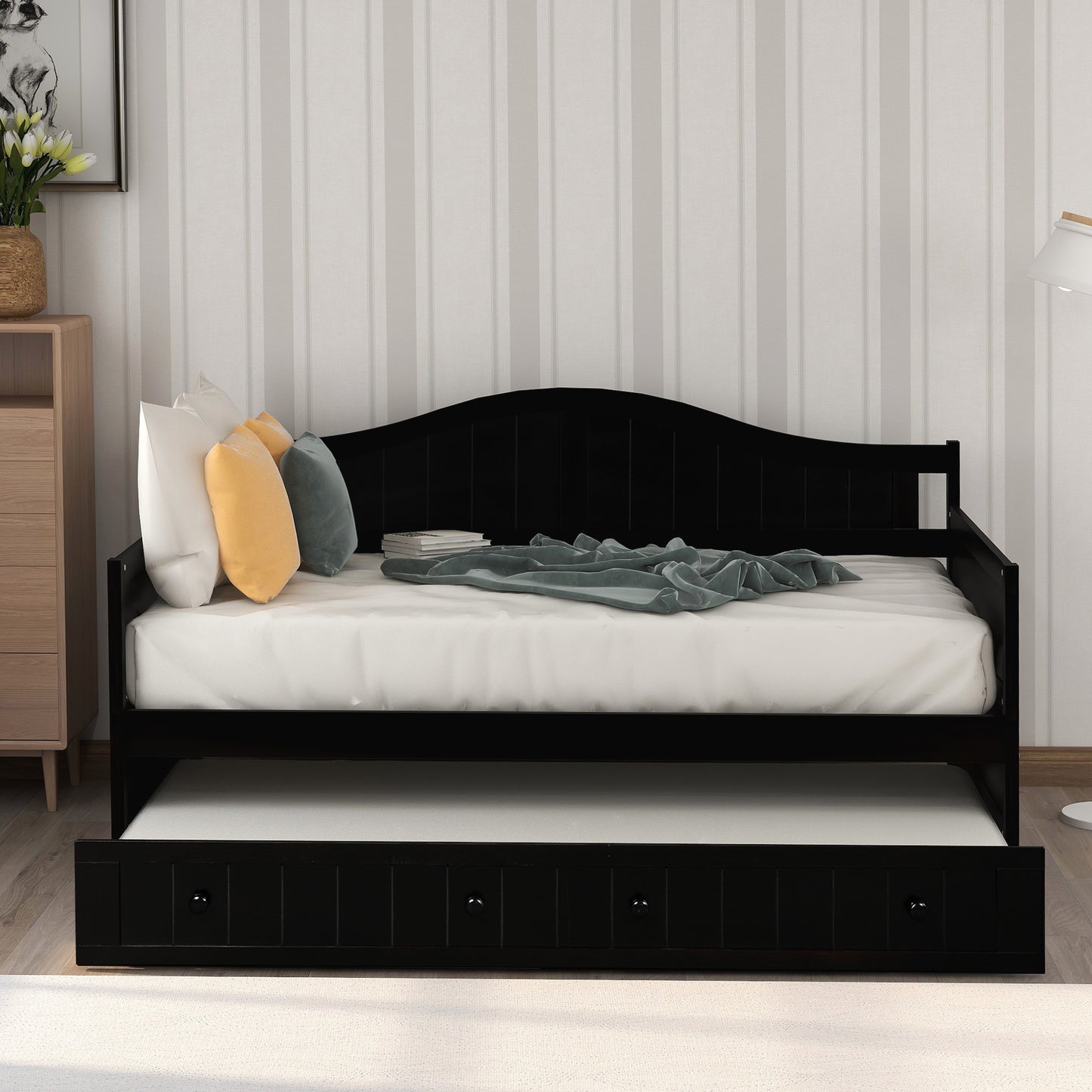 Black wooden daybed with pullout trundle