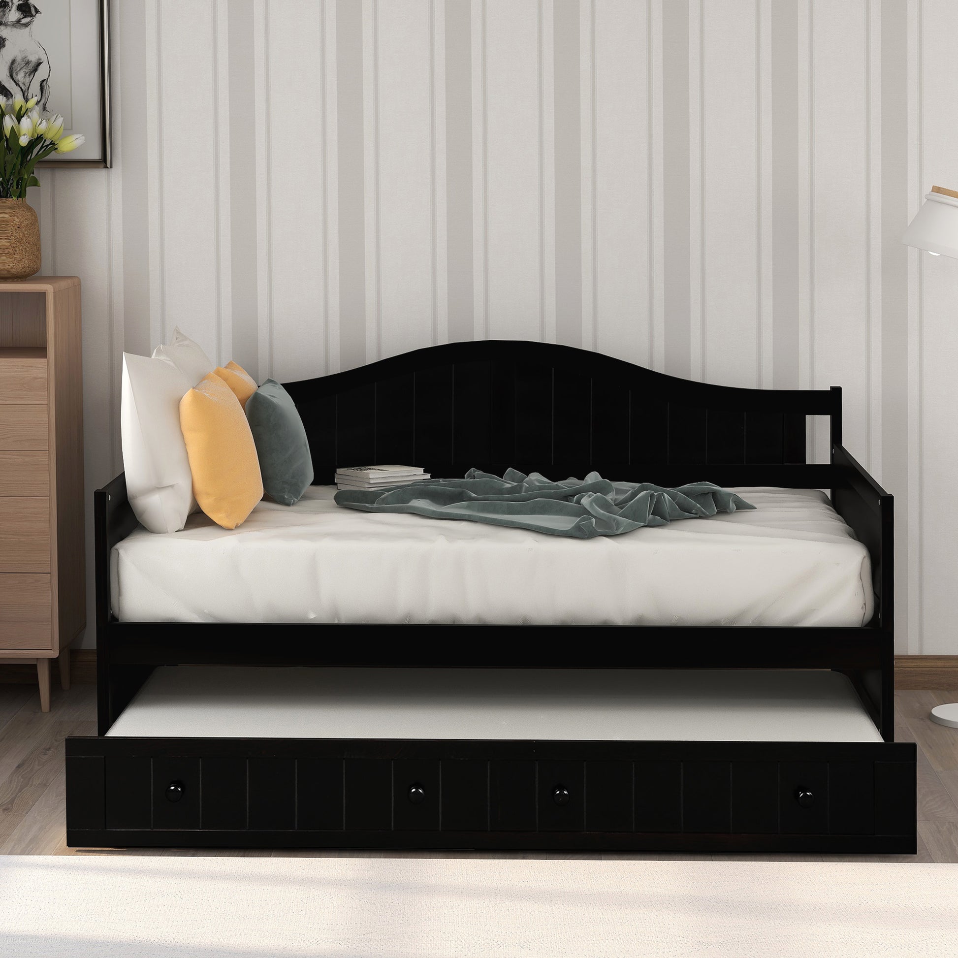 Black wooden daybed with pullout trundle