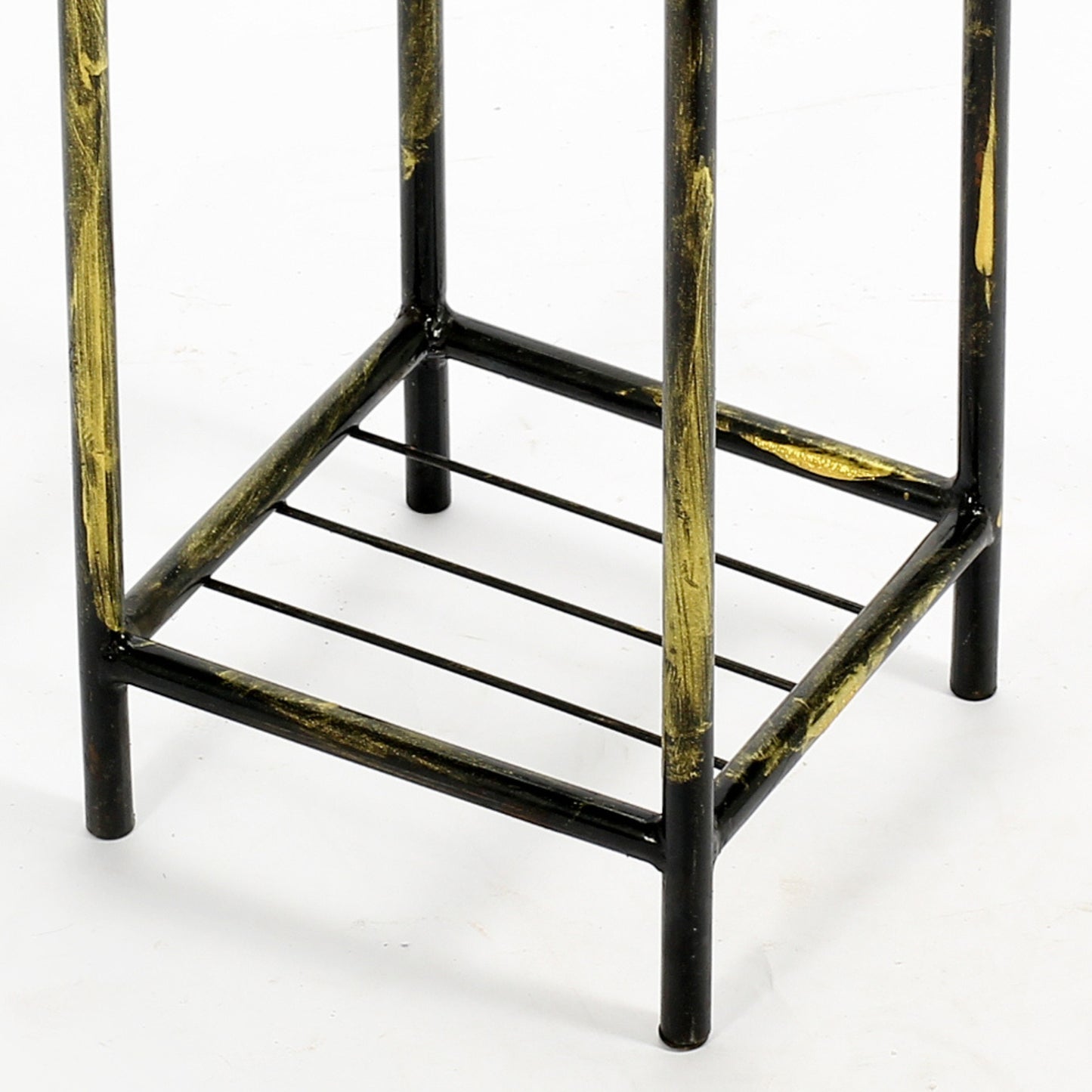 Black and gold metal plant stand base with tiered shelves