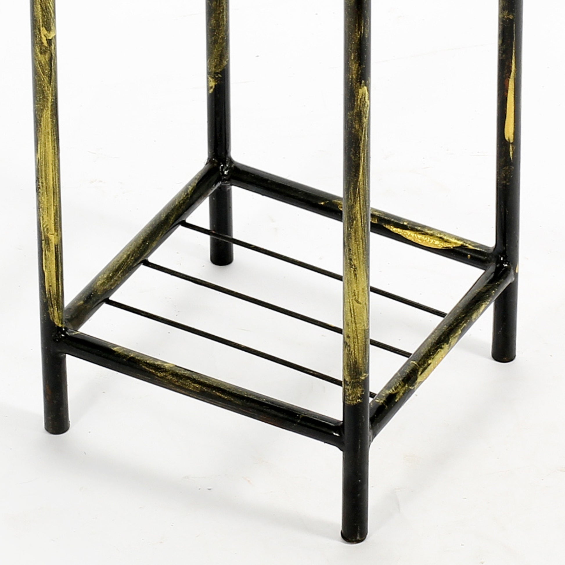 Black and gold metal plant stand base with tiered shelves