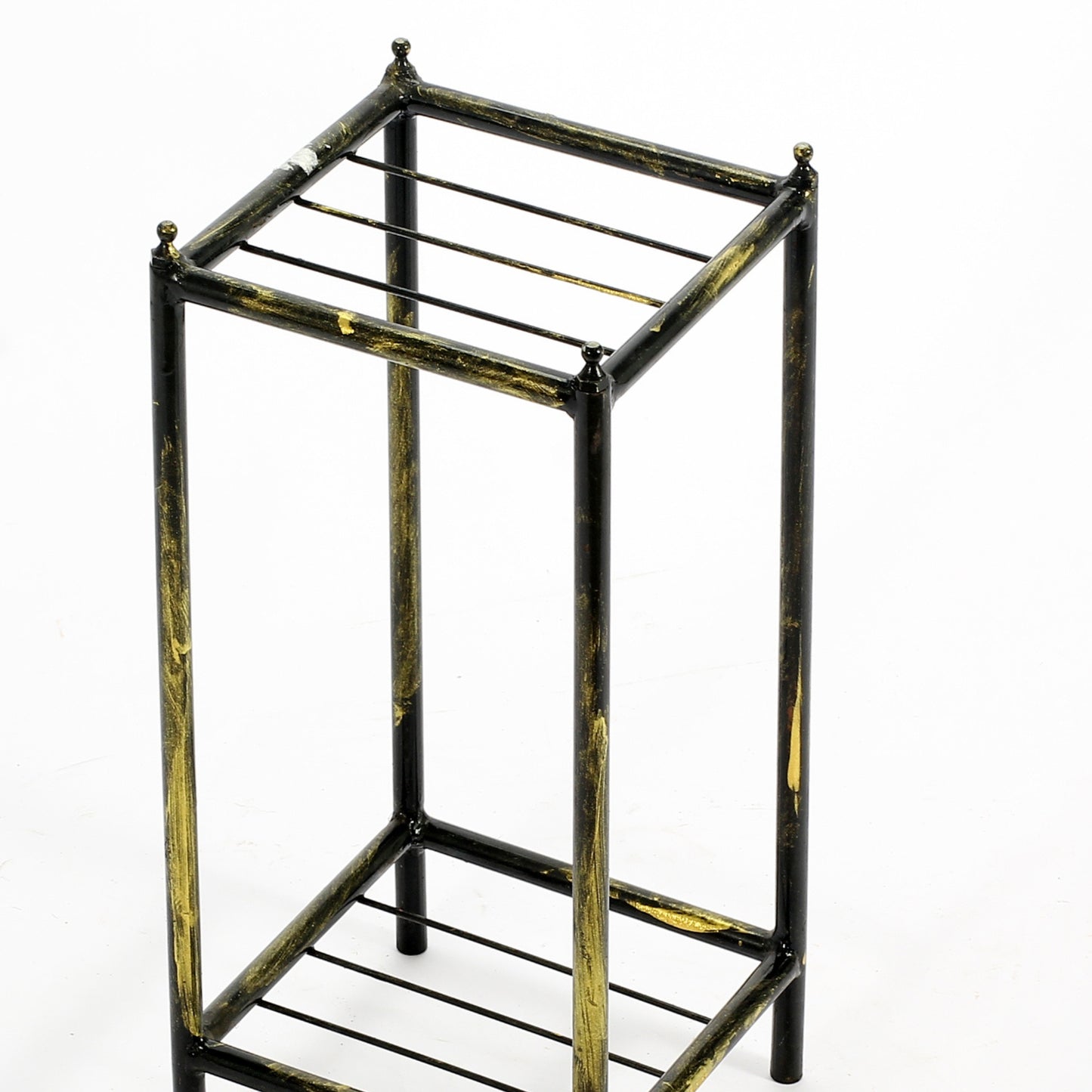 Black and gold wrought iron plant stand with tiered shelving for indoor use