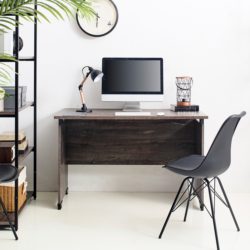 Dark wood computer desk with black chair and monitor