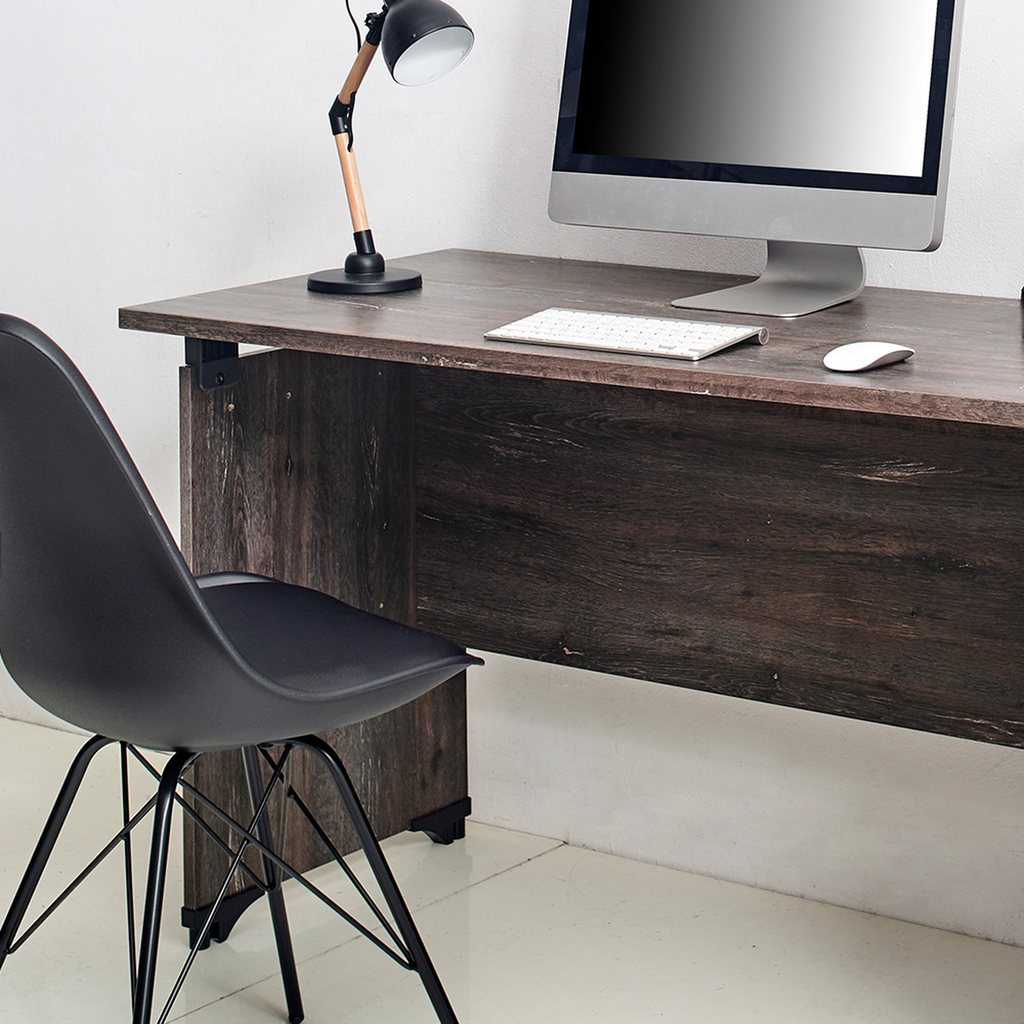 Dark wood office desk with a computer and black modern chair setup