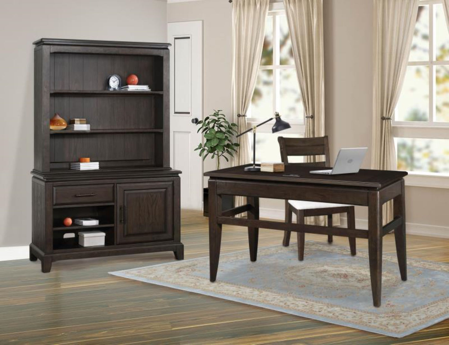 Dark oak executive desk with laptop and lamp