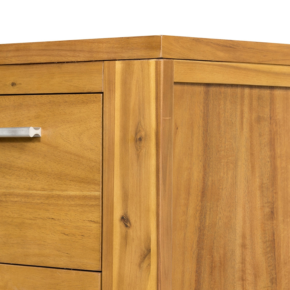 Closeup of natural wood drawer with brushed metal handle