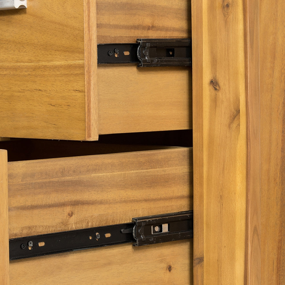 Closeup of wooden dresser drawers with visible metal drawer slides