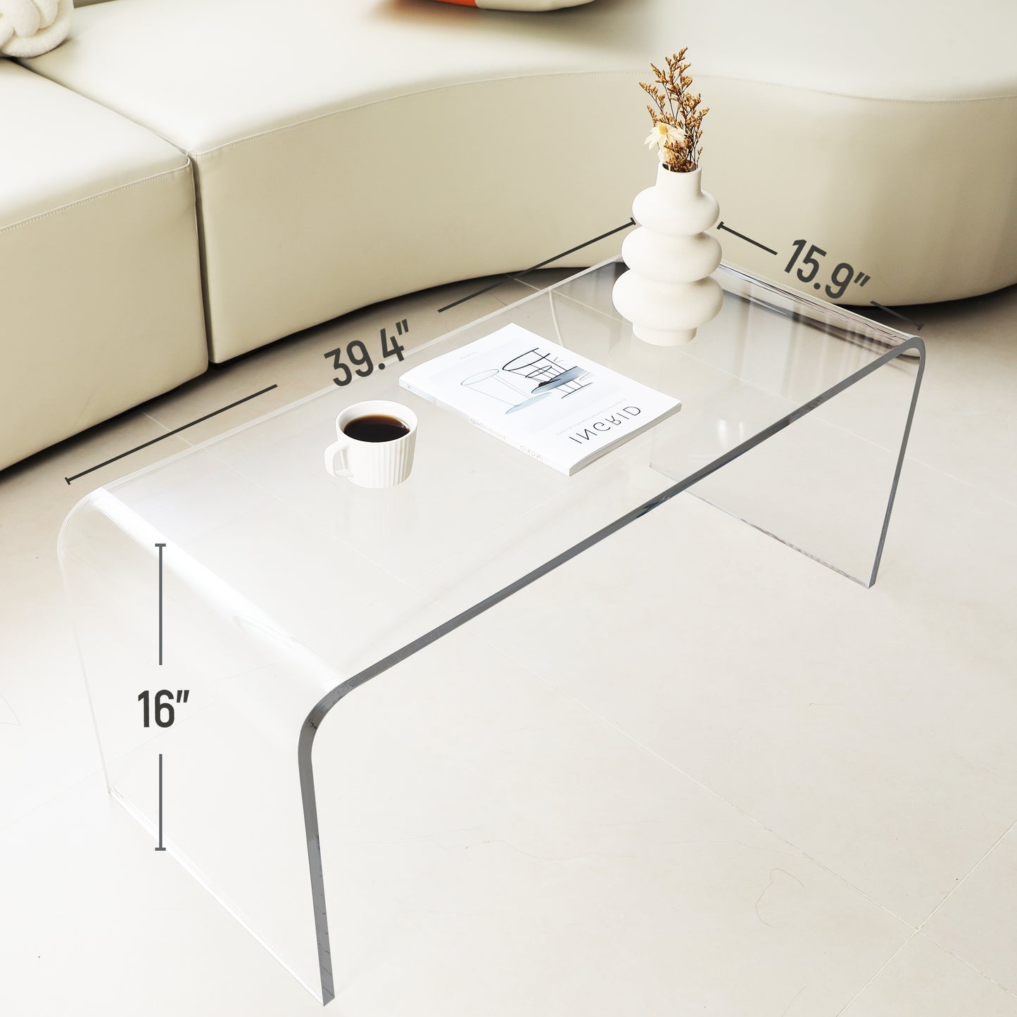 Clear acrylic coffee table with curved edges  L x  W x  H