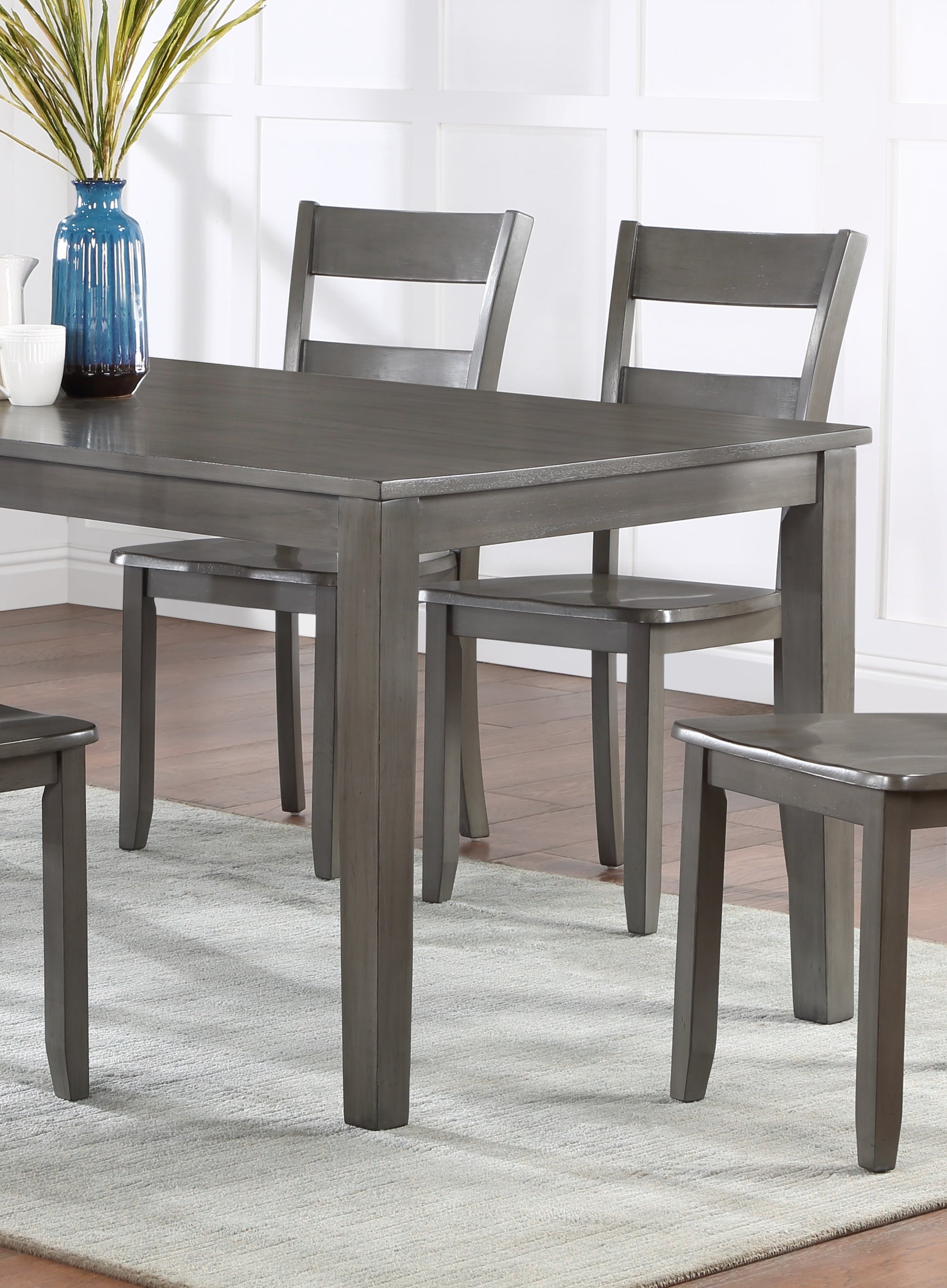 Grey wood dining table with four matching chairs