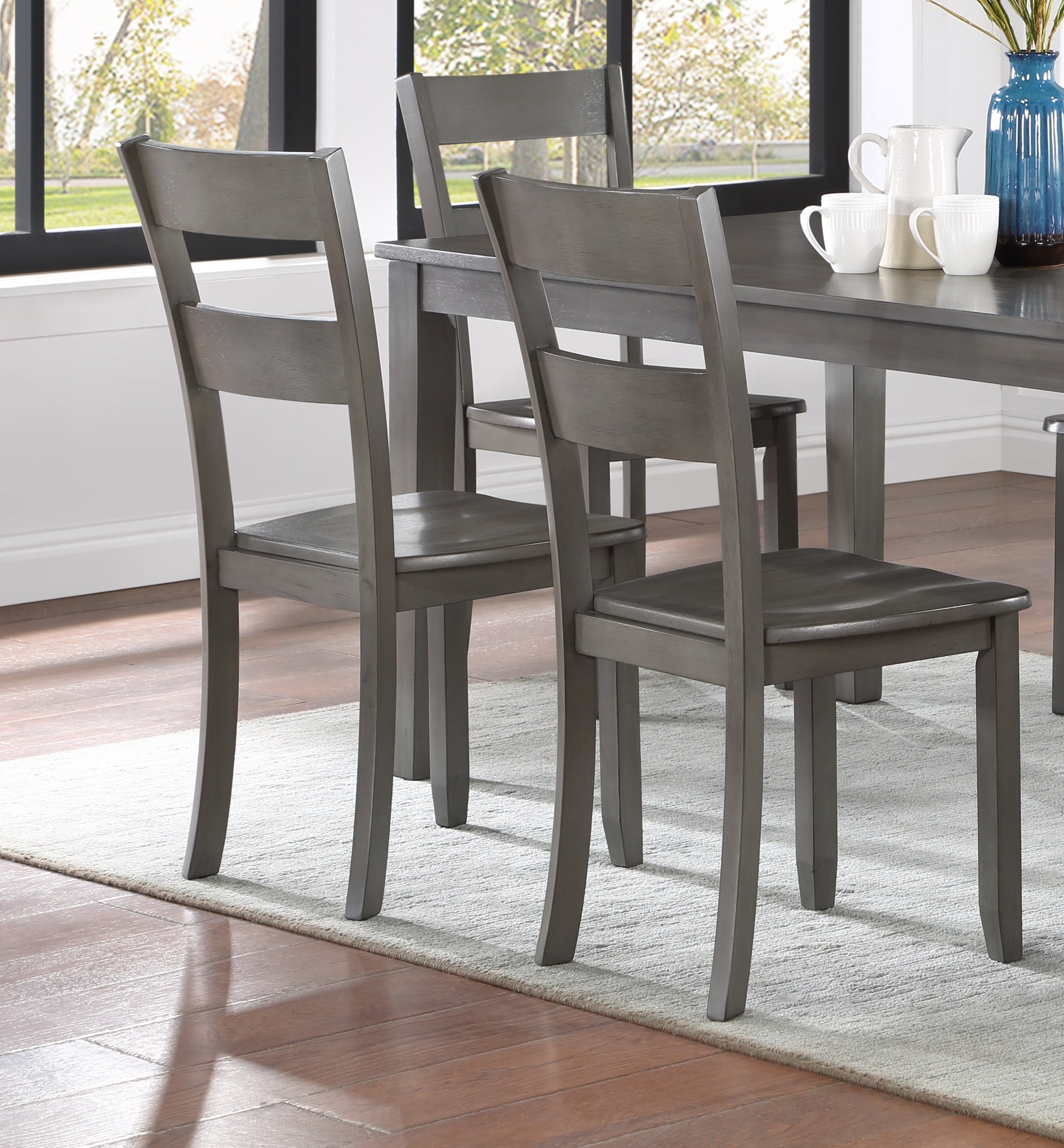 Gray wooden dining chair with a slatted back design