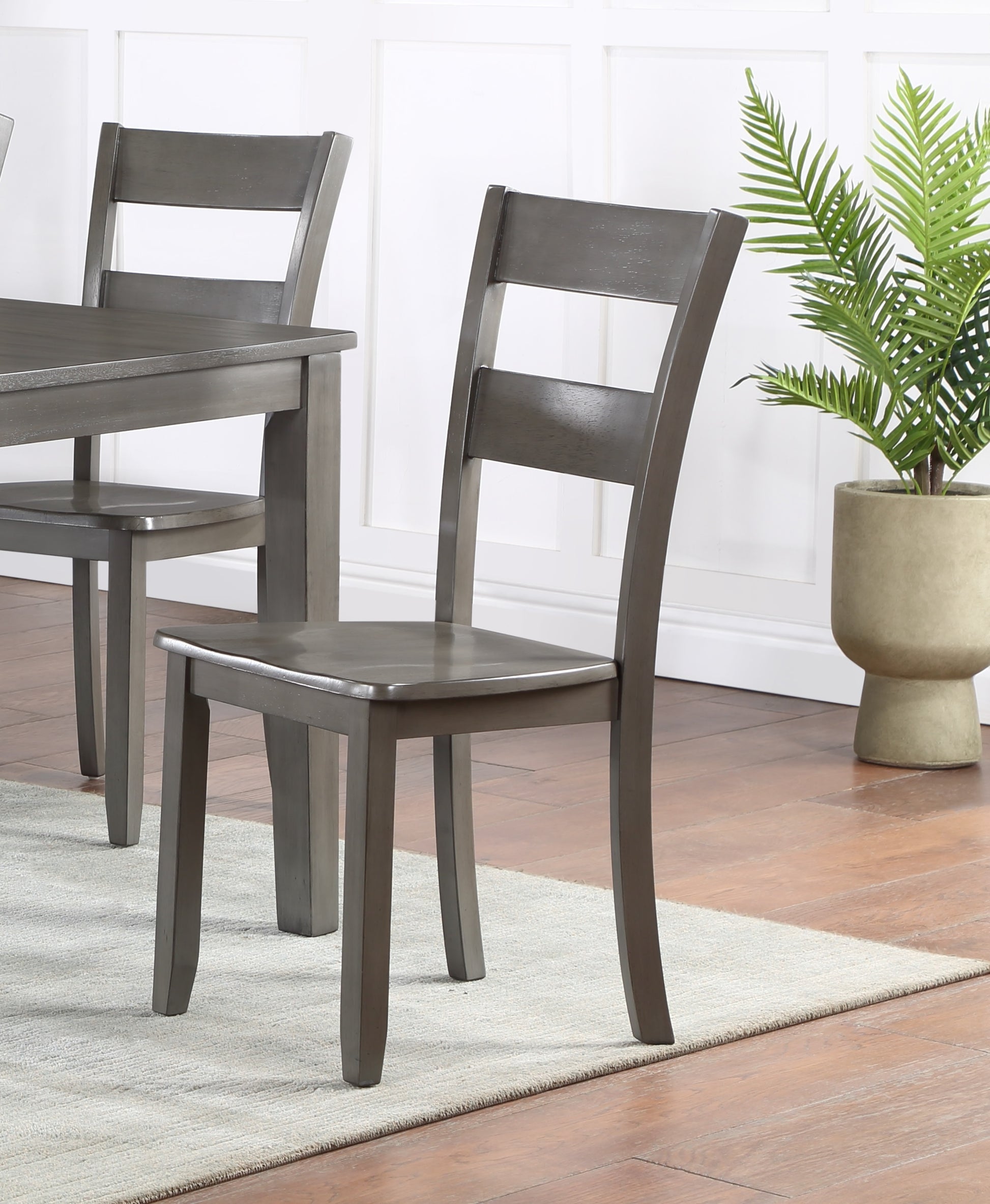 Gray wooden dining chair with ladder back detail