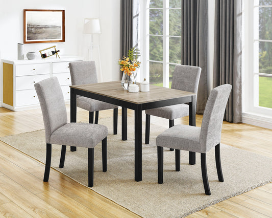 Modern dining table with four grey upholstered chairs and black legs