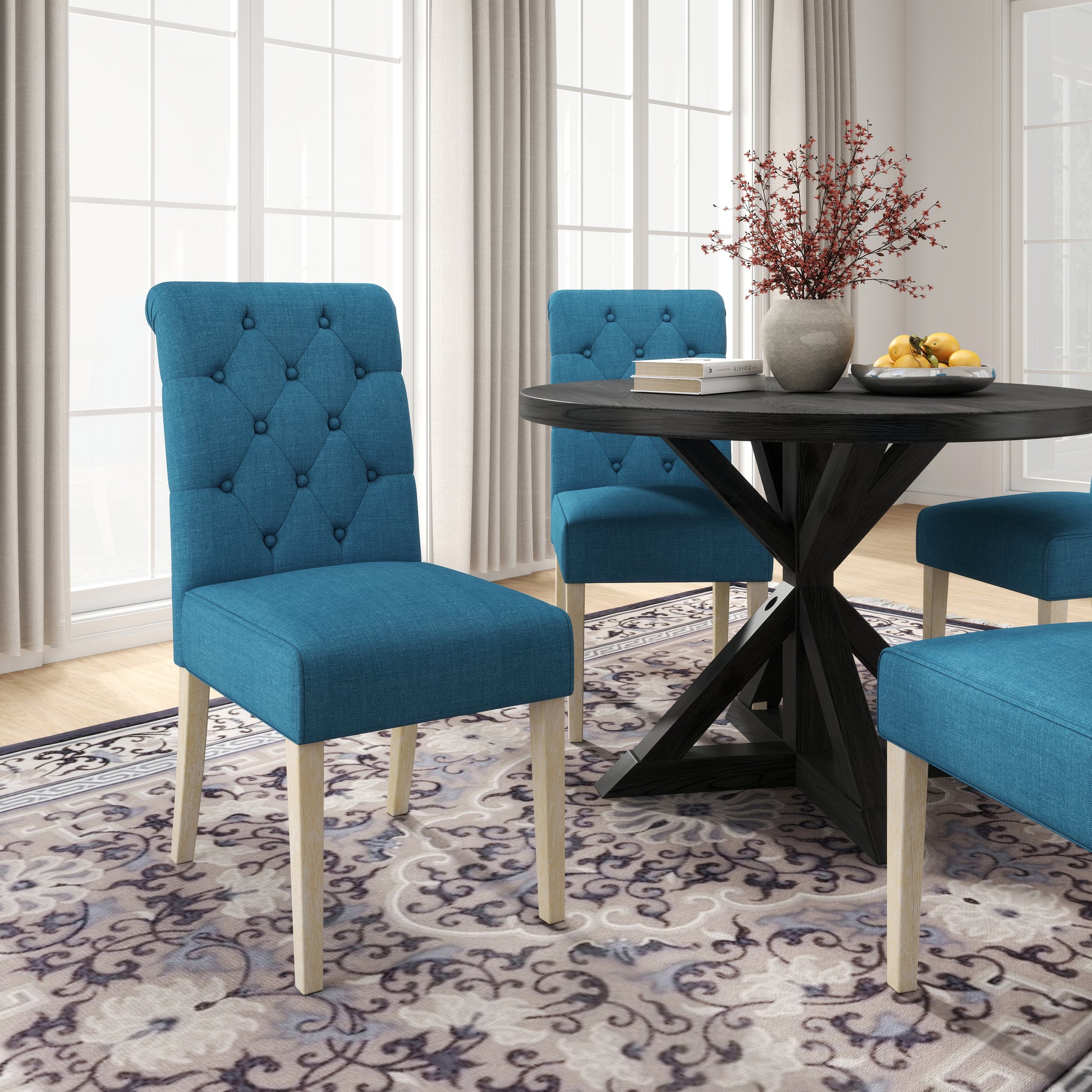 Teal tufted dining chair with light wood legs
